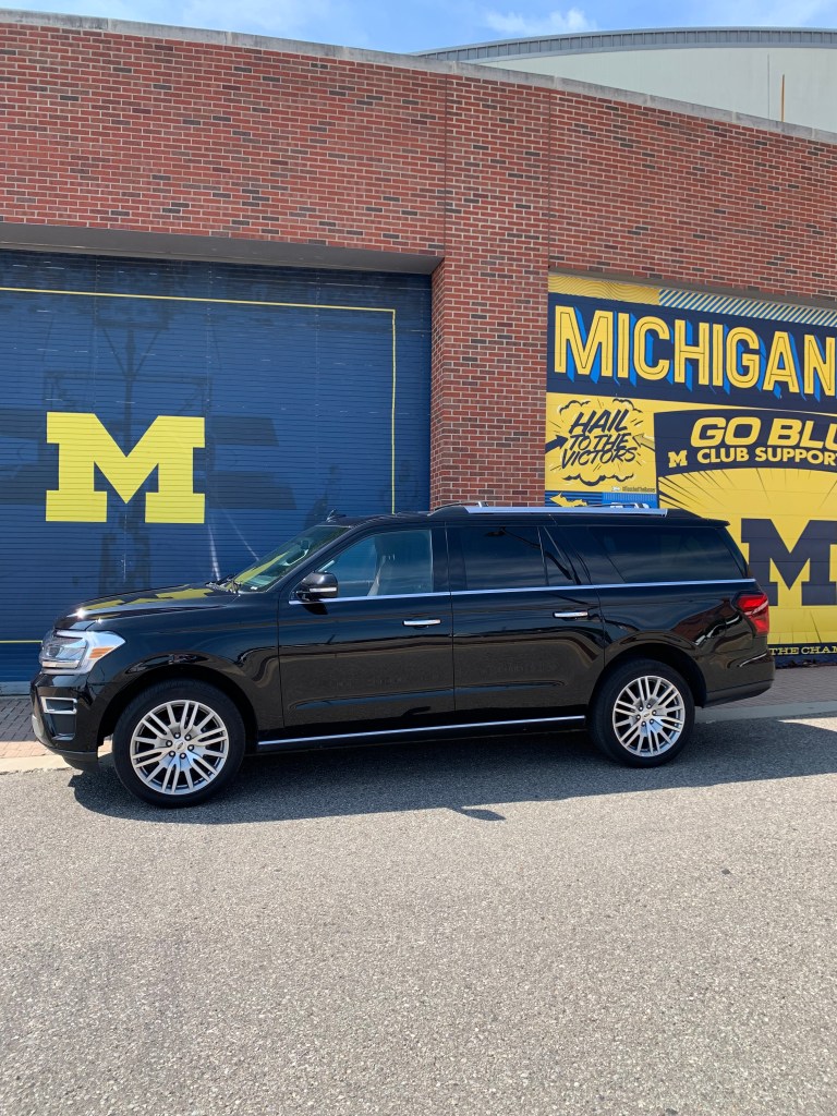 Michigan stadium taxi suv car